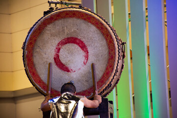 Music band and thai men actress or musician playing hit classic instrument big gong drum and...
