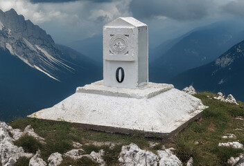 Milestone with zero sign on top of hill