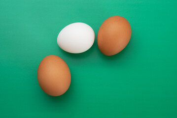 Egg crisis. Chicken eggs lie on a colored background