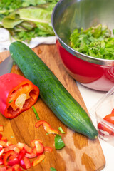 Closeup of vegetables on a wooden cutting board.