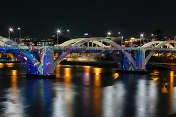 The William Jolly Bridge illuminated at night by projected colours and patterns. Brisbane city.