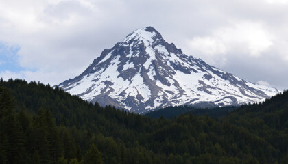 Fototapeta premium Majestic Snow-Capped Peak Amidst Verdant Forest