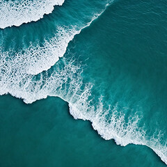 Fototapeta premium Aerial view beautiful of sea waves from drone. Stock image of blue color of ocean water, sea surface. Top view on turquoise waves, clear water surface texture.