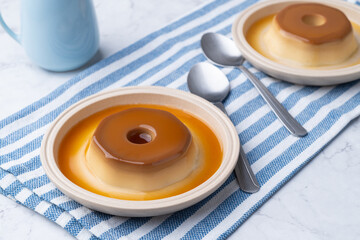 Traditional brazilian condensed milk pudding with caramel syrup