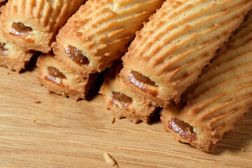 Delicate caramel-filled pastries on a wooden surface ready to enjoy