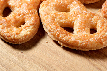 Deliciously baked pretzels on a rustic wooden table