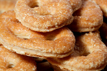 Freshly baked pastries stacked high in a bakery display