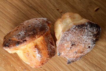 Delightful pastries cooling on a rustic wooden surface in the kitchen