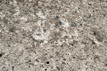 Dirty concrete wall with gravel stones texture background. Old rough and grunge texture wall. Texture of cement wall.