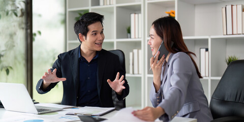 Collaboration and Communication. Colleagues sharing ideas and discussing projects at an office desk.