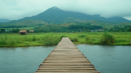 Bridge to Serenity: A weathered wooden bridge stretches across calm waters, leading the eye towards a distant, majestic mountain peak under a moody, overcast sky, with rustic huts in the background.