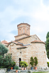 Obraz premium Historic Monastery of Saint Naum with Red-Tiled Roofs and Cylindrical Towers, Ohrid, North Macedonia