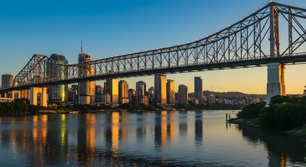 Fototapeta premium Brisbane Story Bridge and City Skyline at Sunset Reflected in Calm Water