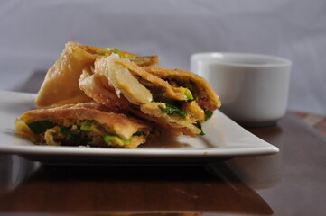 Martabak Telor or Martabak Telur. Savory pan-fried pastry stuffed with egg, meat and spices
