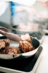 Filet mignon is fried in a pan