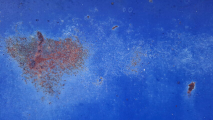Faded Paint with Rust: A detailed study of weathered, faded blue paint, punctuated by patches of...