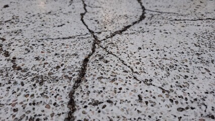 Fractured Surface: An up-close image reveals a textured surface with visible cracks, the intricate patterns created by the fissures adding depth and character.