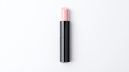 Obraz premium Lipstick in a sleek black case with a soft pink hue, perfectly placed on a white isolated background for beauty presentations.