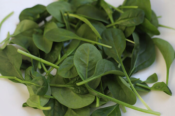 healthy fresh spinach on light background