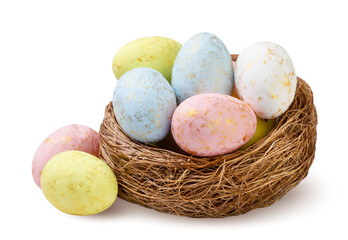 Colorful Easter eggs in a nest close-up on a white. Isolated