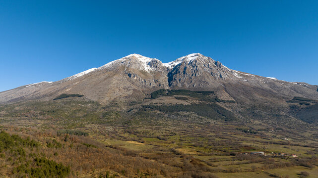Aerial view of the Velino mountain range, in Abruzzo. It is the highest mountain in central Italy. The mountain peaks are snow-capped.