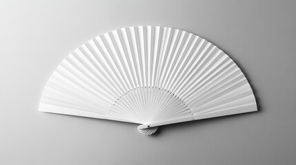 A white folding hand fan displayed separately on a white background