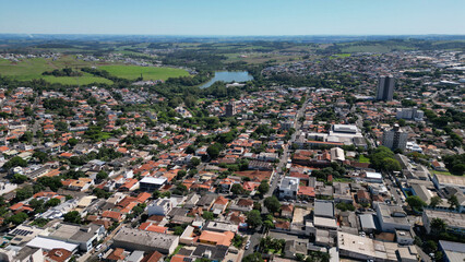 View from above of the city of Apucarana with its houses and Lake Jaboti in the background