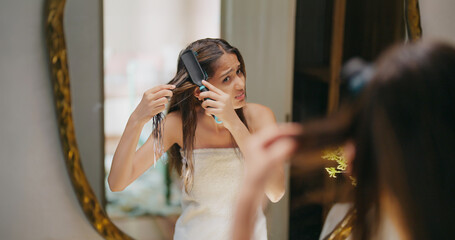 Indian Asian young adult gen z teen girl woman lady female white towel on body sad angry upset look mirror hold comb do on dry frizzy messy hair loss feel bad facing health care issue get ready day