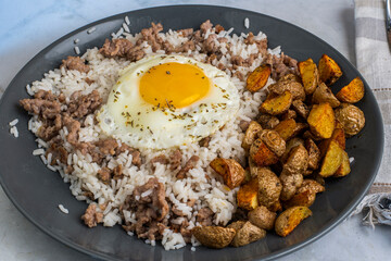 fried egg with  rice  and crumble sausage