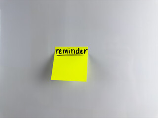 Reminder on self adhesive note paper. Post it note hanging on the refrigerator. Reminder for people with poor memory. Write down important information on paper