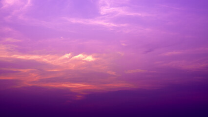 Fototapeta premium Beautiful pastel pink, orange and purple gradient sky background in the evening as the sun sets. Calm winter evening sky. Quiet evening sky atmosphere.