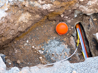 Laying a fiber optic cable for fast internet on the street