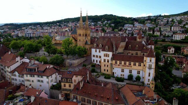 Switzerland travel and scenic places. Aerial drone view of Neuchatel charming town and impressive medieval castle overlooking the lake.
4k hd video