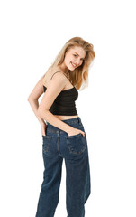 Obraz premium Beautiful blonde in jeans on a white background.