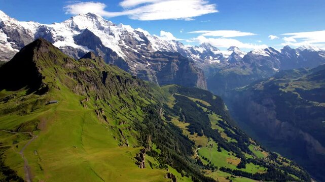 Swiss nature scenery. Switzerland landscape. Scenic snowy Alps mountains. Beauty in nature. Mannlichen mountain, aerial drone 4k hd video
