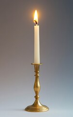 Candle Burning in Brass Candlestick Giving Warm Light and Atmosphere