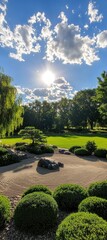 Obraz premium A tranquil garden scene featuring manicured shrubs, rocks, and a beautiful sky with fluffy clouds and the sun shining brightly.