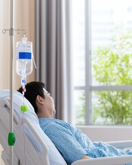 Patient Receiving IV Treatment in Bright Hospital Room