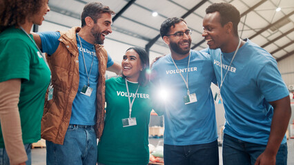 People, volunteer and huddle with support of charity, team building and trust for community service. Smile, staff and hug for ngo meeting of donation event, social responsibility and group solidarity