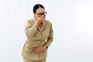 Young civil servant woman covering mouth and holding belly. nauseous concept