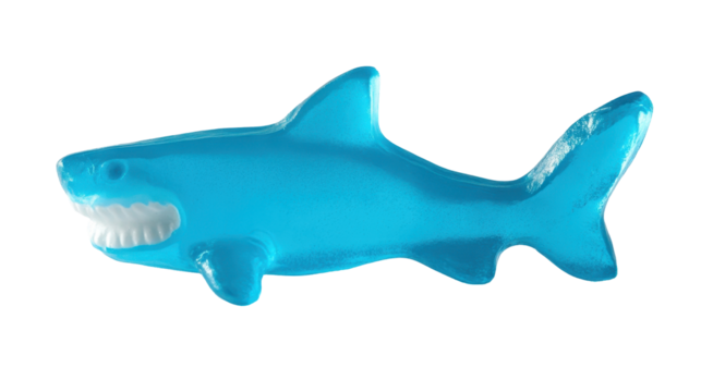 A vibrant blue gummy shark candy with a smiling expression, perfect for party treats or nostalgic snacking.