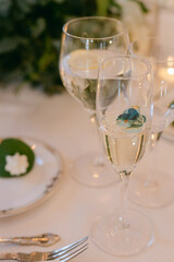 Elegant dining setup featuring sparkling glasses and decorative food at a festive gathering