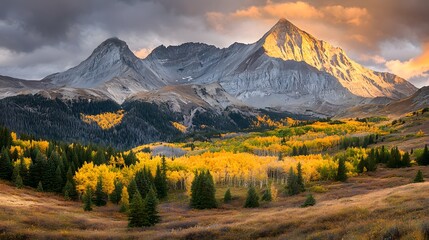 Fototapeta premium Breathtaking Autumn Landscape with Dramatic Mountain Skyline and Warm Sunlight