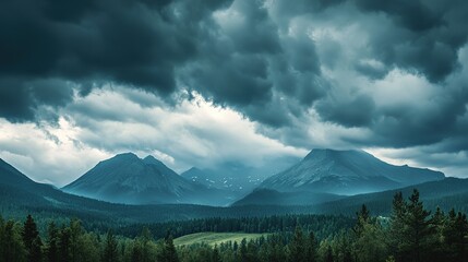 Fototapeta premium Dark storm clouds forming over a distant mountain range.