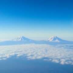 Majestic Volcanoes Above Clouds.