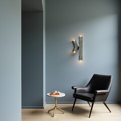 A contemporary interior with muted blue walls, sculptural accents, and a sleek black chair. A blend of modern design and warm details for a stylish, minimalist setting.