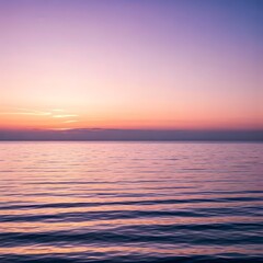 Obraz premium Soft pink and purple hues blending into the horizon as the sun rises over a calm ocean, AI Generated