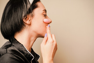 Relaxation of the skin muscles. Moisturizing and caring for facial skin. A woman's radiant and...