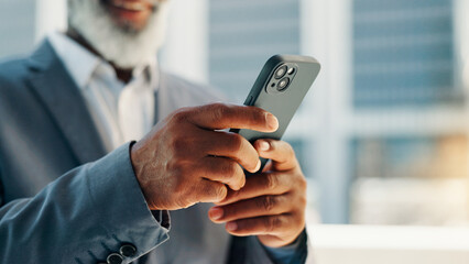 City, cellphone and hands of business man for networking, social media and online for contact. Professional, corporate and person on smartphone for text message, email and website in town for travel