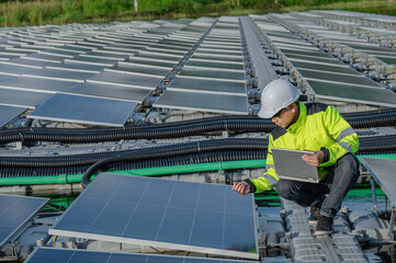 Asian engineer working at Floating solar power plant,Renewable energy,Technician and investor solar...